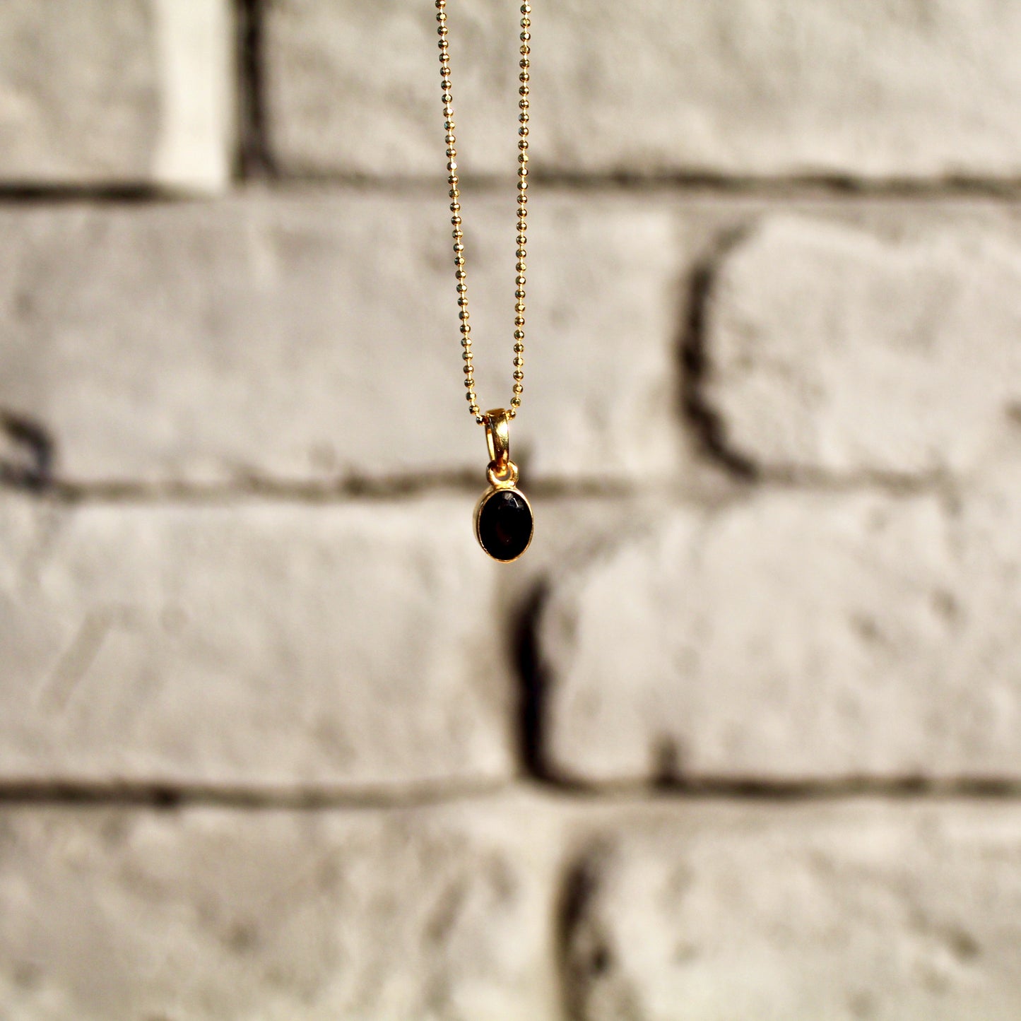 Pendentif en onyx, argent 925 | Or 24 carats | Édition limitée